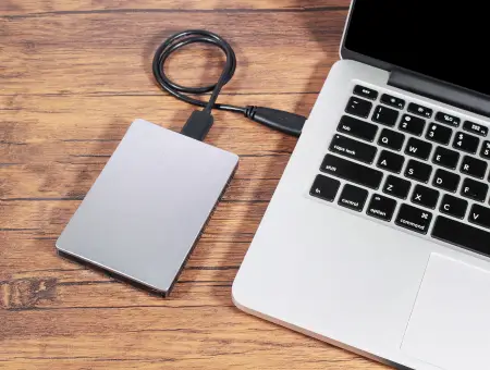 An image of an external hard drive connected to a laptop.